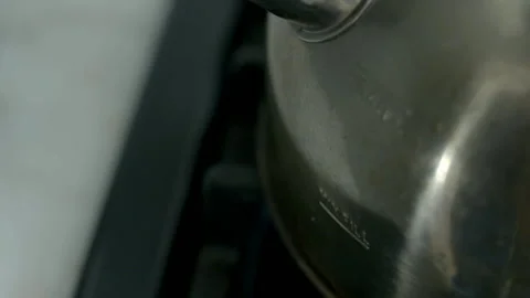 Close Up of Stainless Steel Kettle Heating on Gas Stove Stock Footage 343089924