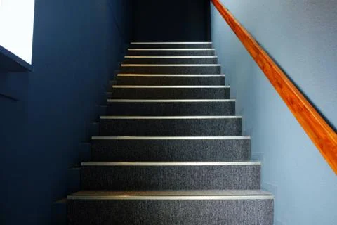 Close up Stair Steps with Light Beam from Window on Wall Surface. Stock Photos