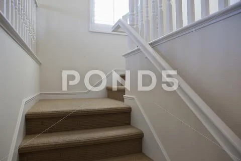 Close-Up Of Stairs With White Walls At Home