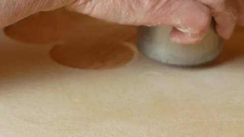 Close up the stamp of pasta that cuts discs pasta for ravioli Stock Footage 112817988