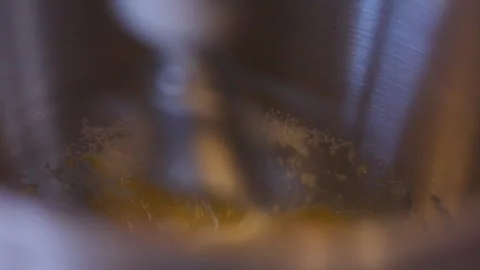 Close-up of stand mixer with eggs and sugar, mixing starts in stainless bowl Stock-Footage 332558681