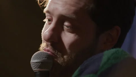 Close Up of Stand Up Performer Sharing Witty Joke on Stage Stock Footage 333228453