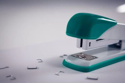Close-up of stapler and pins Stock Photos