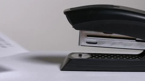 Close up of stapler, stapling sheets of paper 2 Video stock 64477971