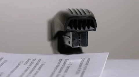 Close up of stapler, stapling sheets of paper  Video stock 64478189