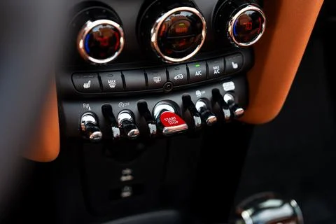 Close up of start and stop ignition buttons placed on dashboard of modern sports Stock Photos