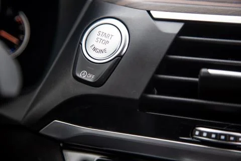 Close-up of a start-stop button on a dashboard in a modern premium luxury car Stock Photos