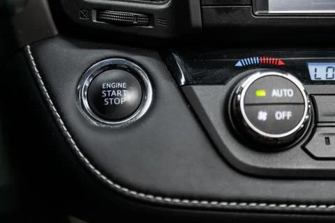 Close-up of start stop engine  button. modern car interior: parts, buttons, k Stock Photos