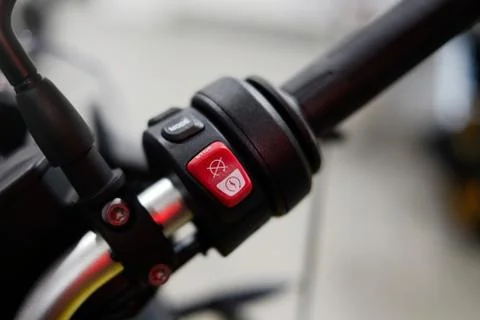 Close start, stop, motorcycle mode button close up, road safety. Stock Photos