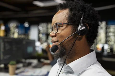 Close up of startup helpdesk admin speaking in headset microphone 写真素材