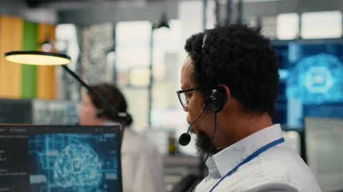 Close up of startup software developer doing tech support, helping users Stock Footage 323408655