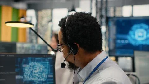 Close up of startup software developer doing tech support, helping users 写真素材
