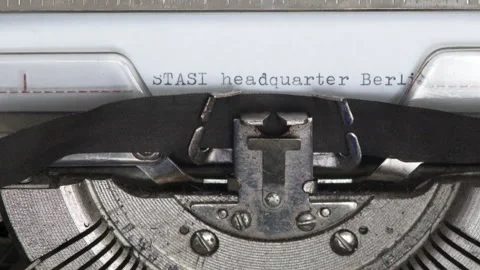 Close up STASI HEADQUARTER BERLIN being typed on vintage typewriter Stock Footage 185136482