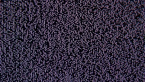 Close-up of static noise or snow on a television screen, showing a pattern .. Stock Footage 315019562