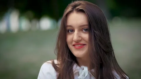 Close static shot of cheerful and beautiful young woman college student with Stock Footage 254095545