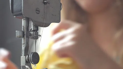 Close Up Static Shot of Child Hands Threading Needle on Vintage Sewing Machine Stock Footage 346612020