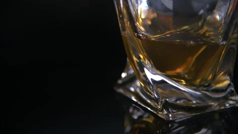 Close Static Shot of Full Modern Whiskey Glass Stock Footage 140821047