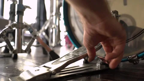 CLOSE UP static  Shot of The guy sets the drum pedal Stock Footage 155554820