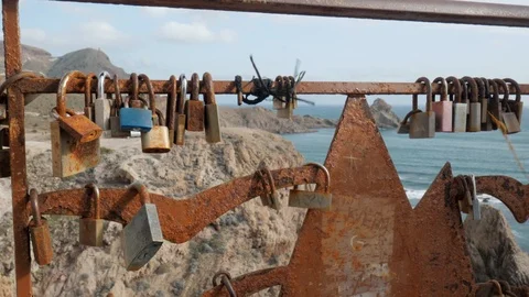 Close up static shot of love locks attached on fence Stock Footage 121624356