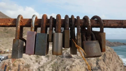 Close up static shot of love locks attached on fence. Stock Footage 121671292
