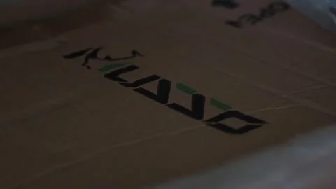 Close-Up Static Shot of Removing Plastic from Chair Box 库存影片 335379306