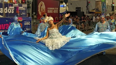 Close-up static shot of a woman dancing in a large dress during a Rio de Video stock 336033542