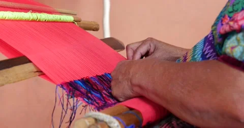 Close up static shot of Woman's hand weaving colorful fabric in Guatemala Stock Footage 221524893