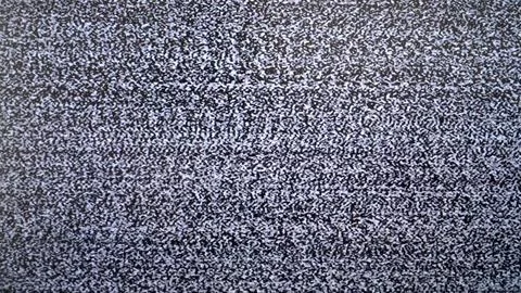 Close-up of static tv screen with black and white noise Stock Photos