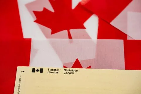Close up of Statistics Canada envelope on Canadian flags. Toronto, Canada - July Stock Photos
