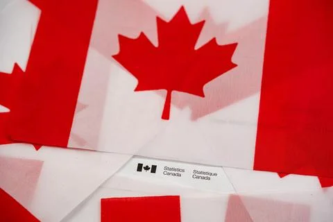 Close up of Statistics Canada envelope on Canadian flags. Toronto, Canada - July Stock Photos