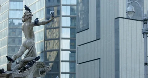 Close Up of Statue In New York With Iconic New York Impressive Skyscrapers In Stock Footage 112315810