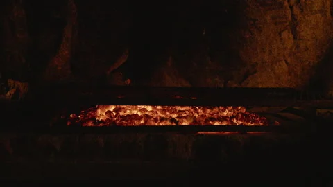 Close up of steak being placed on a flaming BBQ grill Stock Footage 135819098