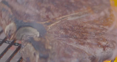 Close-Up of Steak Being Pulled Off the Grill with Natural Sizzle Sound Stock-Footage 140810410