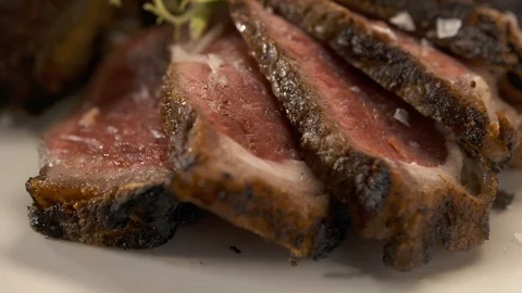 Close up of steak panning right and up  動画素材 112660471