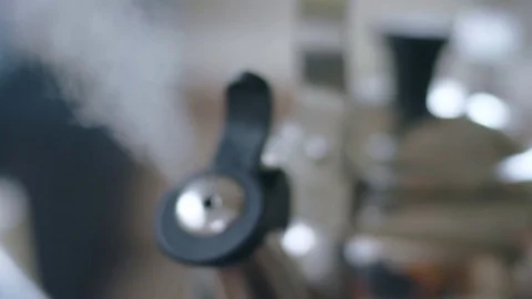 Close-up of steam coming out as hispanic man lifts tea kettle Stock Footage 84476271