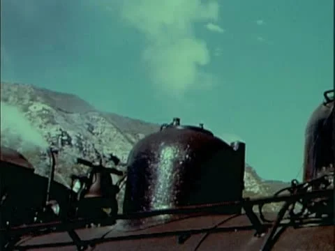 CLOSE-UP OF STEAM TRAIN WHISTLE BLOWING 1 - COLOR Stock Footage 22111492