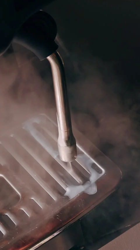 Close Up Of Steam Wand Cleaning Drip Tray With Residual Milk Foam And Rising Ste Stock Footage 331415901