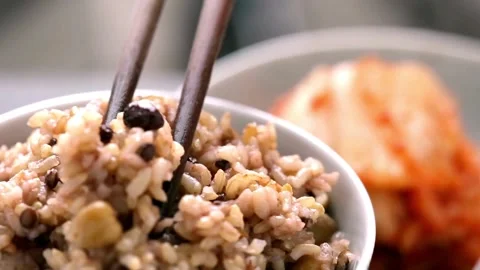 Close-Up of Steamed Brown Rice with Beans in 4K Video Stock Footage 251900672