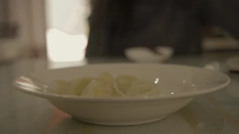 Close-Up of Steamed Dumplings on Plate in Beijing Restaurant Dining Scene Stock Footage 345892597