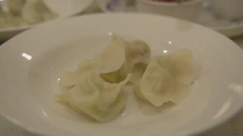 Close Up of Steamed Dumplings on Plate in Beijing Restaurant, China Stock Footage 345892737