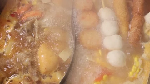 Close up of steaming boiling Oden hot pot with fishballs Stock Footage 339417215