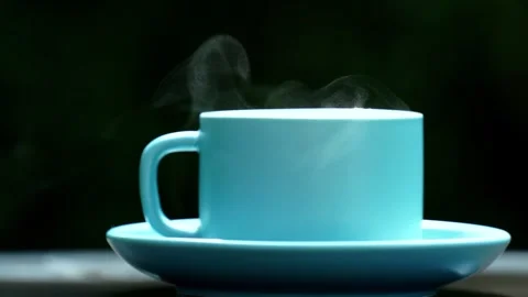 Close-up steaming hot coffee, Hot ceramic white coffee cup  Video stock 253536306