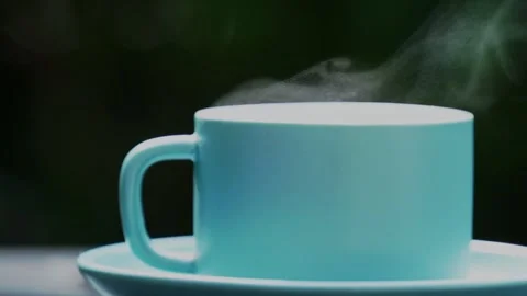 Close-up steaming hot coffee, Hot ceramic white coffee cup  Stockbeeldmateriaal 253536312