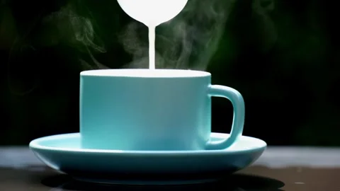 Close-up steaming hot coffee, Hot ceramic white coffee cup  Stockbeeldmateriaal 253536387
