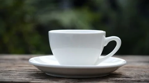 Close-up steaming hot coffee or tea cup, slow motion. Stock Footage 142675233