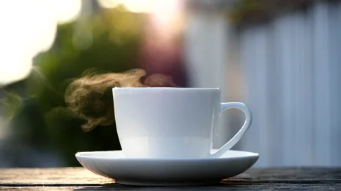 Close-up steaming hot coffee or tea cup, slow motion.Hot Coffee Drink Concept Stock Footage 143155636