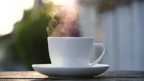 Close-up steaming hot coffee or tea cup, slow motion.Hot Coffee Drink Concept Stock Footage 143155995