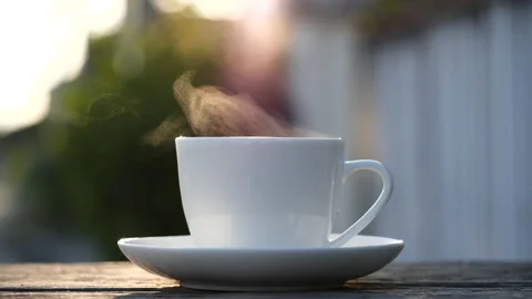Close-up steaming hot coffee or tea cup, slow motion.Hot Coffee Drink Concept Stock Footage 143156257