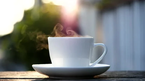 Close-up steaming hot coffee or tea cup, slow motion.Hot Coffee Drink Concept Stock Footage 143156580