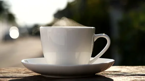 Close-up steaming hot coffee or tea cup, slow motion.Hot Coffee Drink Concept Stock Footage 143157663